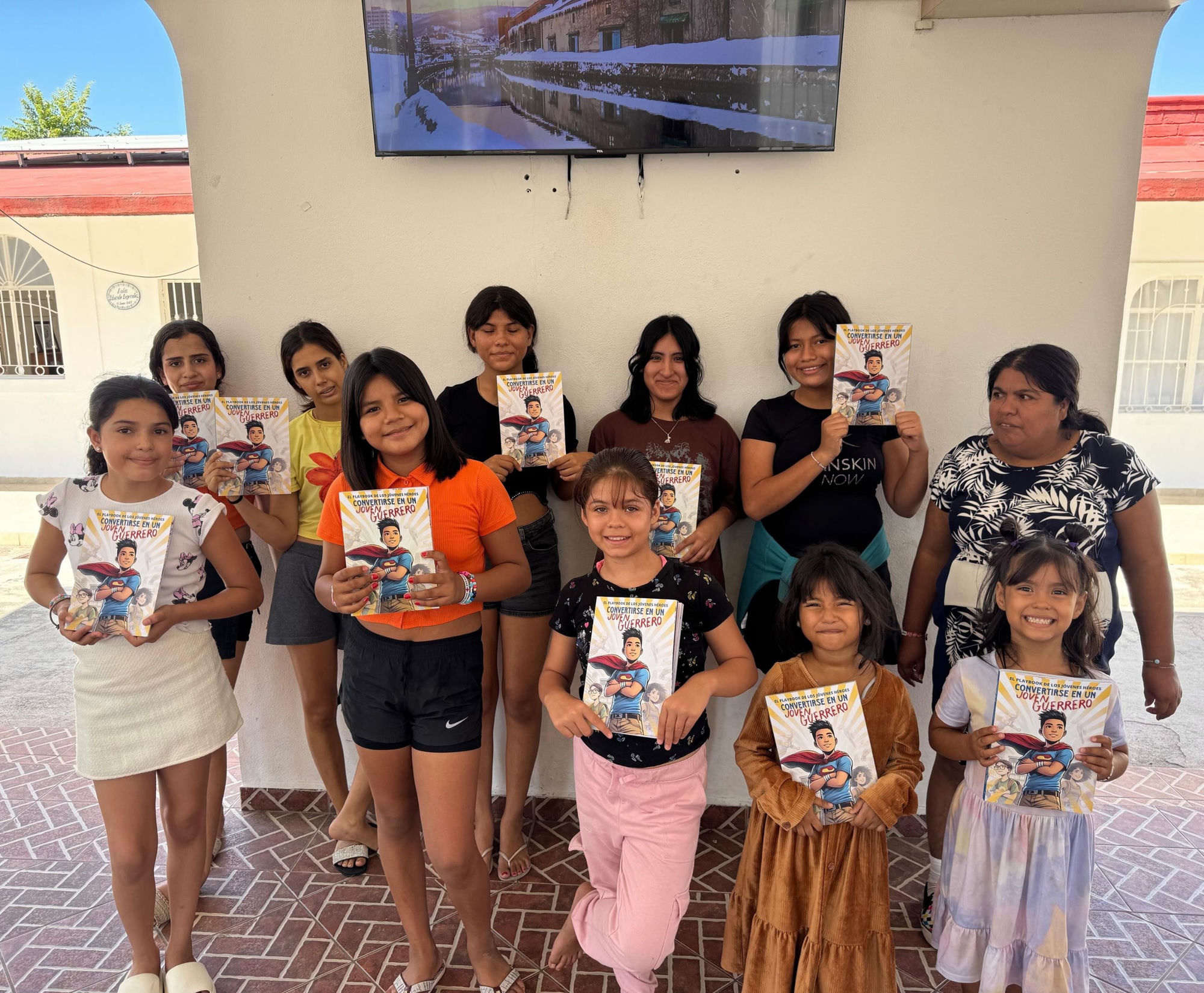 Now — Casa Hogar Jalisco, kids holding the Warriors Compass curriculum
