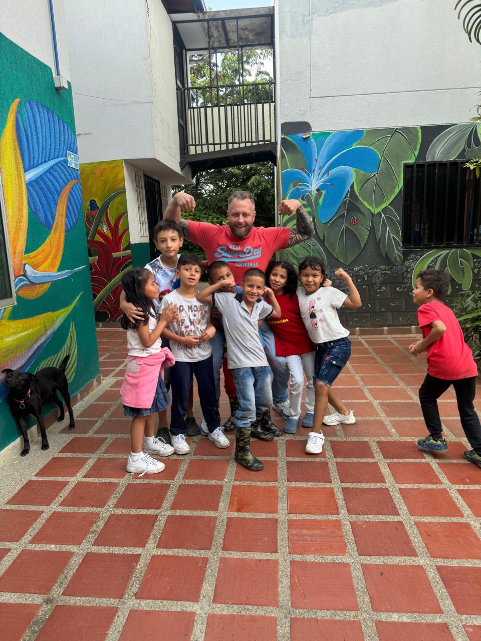 Next — Global expansion, orphanage courtyard with kids in shirts